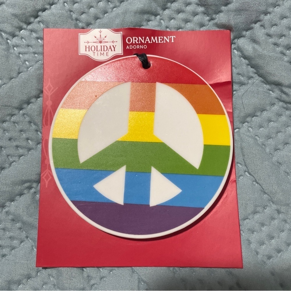 Holiday time pride peace sign rainbow ceramic ornament.